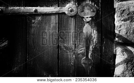 Old Door Handle On Old Door With Long Hinge