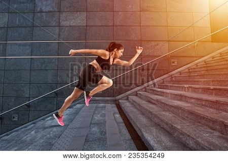 Beautiful Girl Runs Fast On A Modern Stair