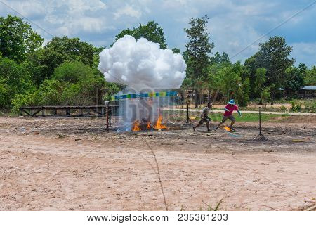 Kalasin, Thailand - May 22, 2016: People Running Out From Ancient Style Rocket After Ignition Dynami