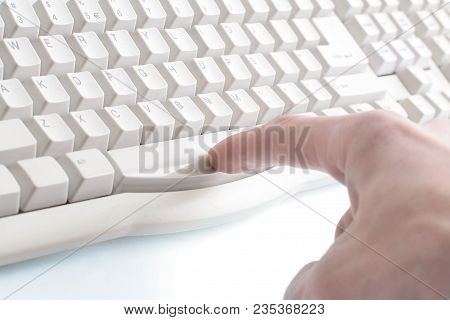 Index Finger Presses The Spacebar On The Keyboard