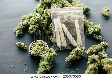 Rolled Jamb Joint In The Hands Of A Man Marijuana Weed And Grinder For Weed, Concepts Of Smoking Mar