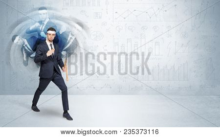 Young businessman in suit fighting with chart and report concept