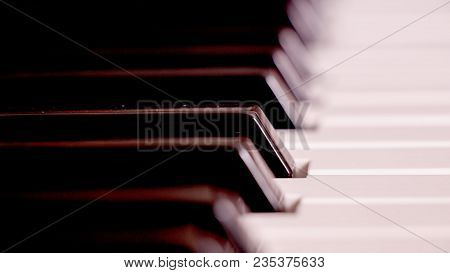 Piano Keyboard Background With Selective Focus. Warm Color Toned Image