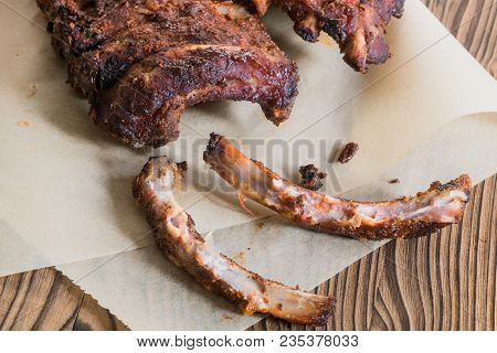 Grilled Spareribs With Gnawed Bones On Backed Paper - Detail