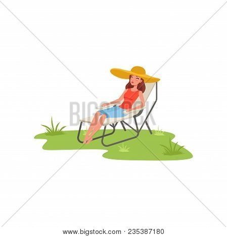 Young Woman Sitting In A Folding Chair, Woman Enjoying Her Vacations, Traveling, Camping And Relaxin