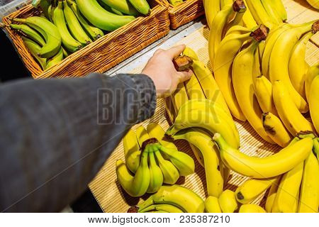First-person View. Man Takes Bananas In Store. Grocery Shopping Concept