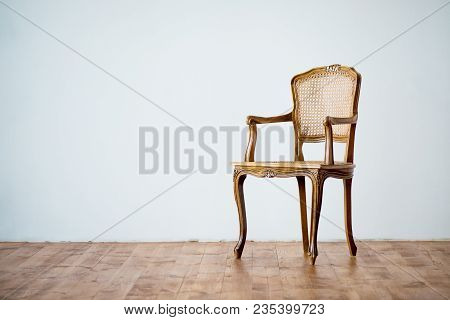 Old Chair On A Gray Wall Background
