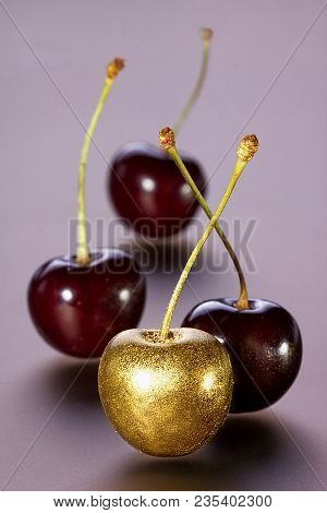 Gilded Decorative Cherries On A Pink Background