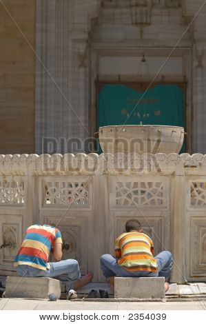 Young Muslim Boys Preparing For The Prayer