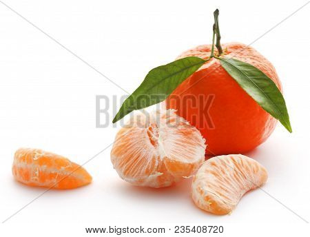 Fresh Orange With Green Leaves Over White Background