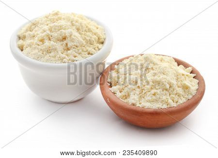 Gram Flour In Bowl Over White Background