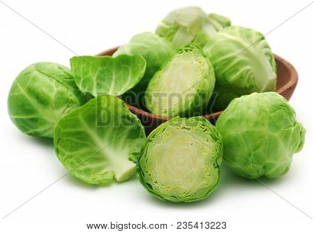 Rosenkohl Or Brussels Sprout In A Bowl Isolated Over White Background