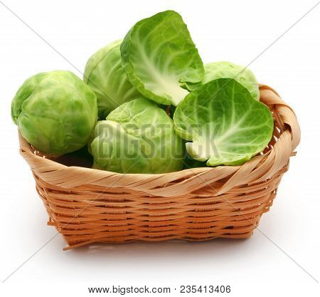 Rosenkohl Or Brussels Sprout In A Basket Isolated Over White Background