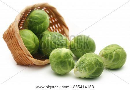Rosenkohl Or Brussels Sprout In A Basket Isolated Over White Background