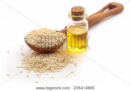 Peeled Sesame Seeds With Oil In A Jar Over White