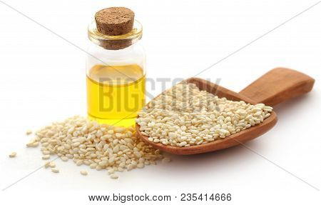 Peeled Sesame Seeds With Oil In A Jar Over White