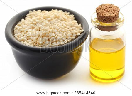 Peeled Sesame Seeds With Oil In A Jar Over White