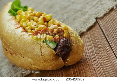 Texas Chili Dog -  Topped With Hearty Texas Chili, Freshly Grated Cheese And Chopped Sweet Onion.