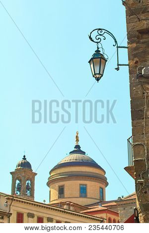 Street Landern In Bergamo, Italy With The Bell Tower And Dome Of Cathedral, Citta Alta Or Upper Town