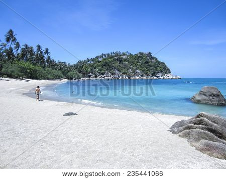 Tourists On The Sand Of Remote Haad Tien Beach On Koh Phangan Island In The Gulf Of Thailand