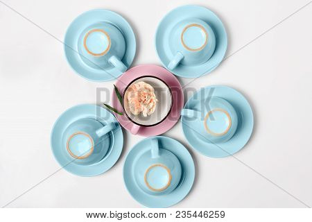 Overturned Coffee Or Tea Set. Plenty Of Elegant Porcelain Light Blue And Pastel Pink Cups Bottoms An