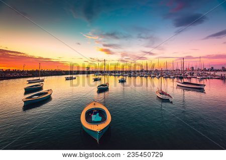 Yachts Anchored In A Row At St. Kilda Beach At Sunset, Victoria, Australia