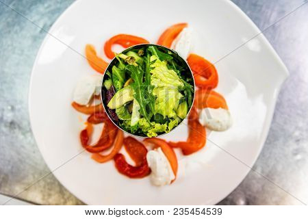 Close Up White Plate With Salad Ingredients At Cooking Workshop