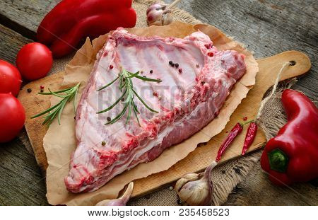 The Ribs On The Wood  Board With Vegetables.