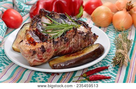 Ribs Grill On A Plate With Vegetables.