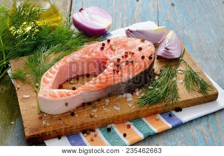 Salmon Stake With Species On Wood Board.
