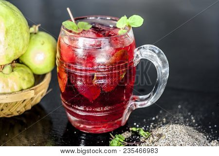 Close Up Of Popular Indian Shrabat Of Guava With Sugar And Masala In A Glass With Raw Fresh Guava On