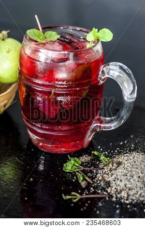 Close Up Of Popular Indian Shrabat Of Guava With Sugar And Masala In A Glass With Raw Fresh Guava On