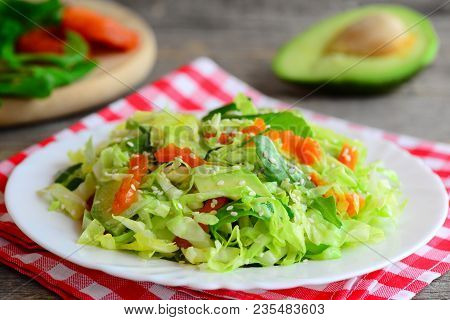 Fresh сabbage Salad With Avocado. Homemade Cabbage Salad Avocado, Dried Apricots, Arugula And Sesame