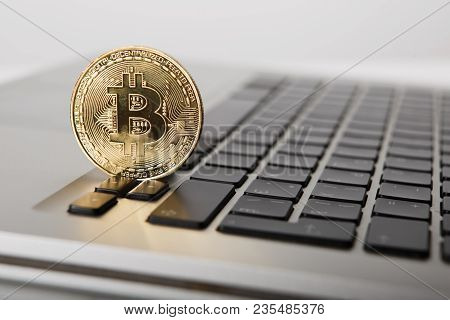 Golden Bitcoin - New Virtual Money On Notebook. A Visual Representation Of Digital Cryptocurrencies.