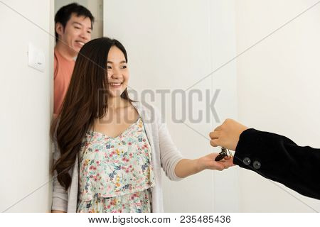 Real Estate Agent Give House Key To Owner