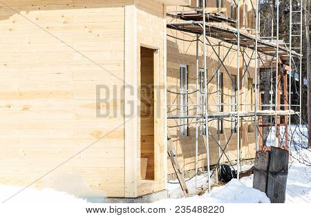 Building Is Under Renovation. Scaffolding. Sunny March Day