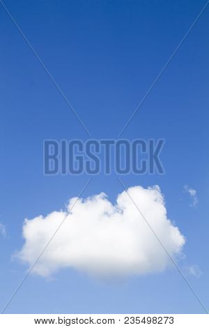 Small White Cloud On A Blue Sky