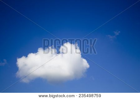 Small White Cloud On A Blue Sky
