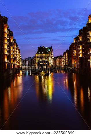 The Warehouse District - Speicherstadt In Twilight. Tourism Landmark Of Hamburg. View Of Wandrahmsfl
