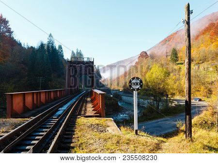 Autumn Carpathian Mountains Landscape With Railroad Bridge, Mountain Tysa River, Dam And Road Down (