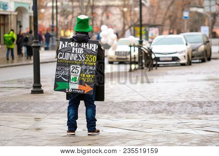 Moscow, Russia - April, 2, 2018: promoter stands with an  advertisement in Mosocw