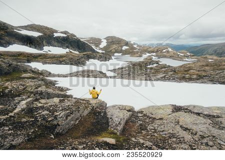 Typical norwegian landscape with snowy mountains and clear lake near the famous Aurlandsvegen (Bjorgavegen), mountain road, Aurland, Norway.