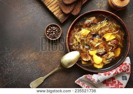 Russian Vegetarian Sour Cabbage Soupe (shchi) With Dried Mushrooms In A Clay Bowl On A Dark Slate, S
