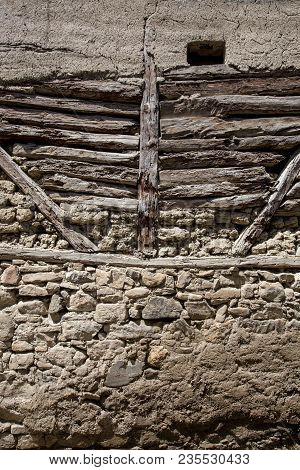 Stone Wall With Stone, Wood And Mud Background
Rustic Wall In A Old Construction With Stone, Wood An