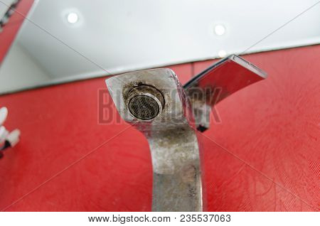 Solid Water And Rust On The Washbasin In The Bathroom