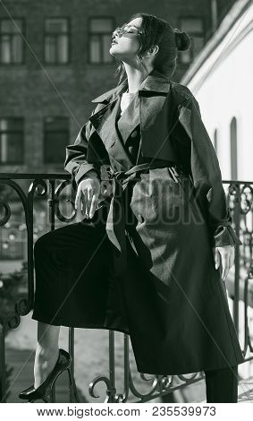 Beautiful Elegant Brunette Woman Wearing Green Coat On The Balcony