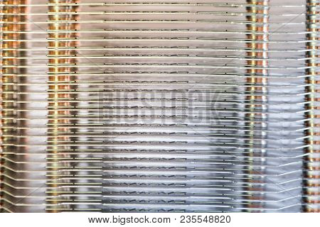 Aluminum Radiator With Copper Heat Pipe Close-up With Beautiful Bokeh Metallic Background
