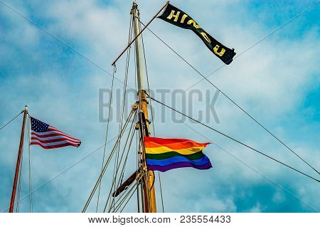 Three Flags On Yachts Masts In Provincetown' Marina, Massachusetts