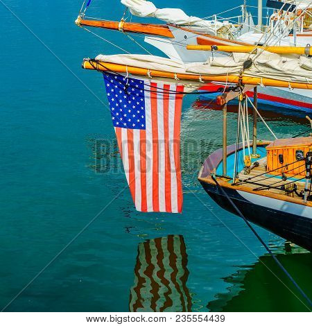 Provincetown Marina Star And Stripes Reflected In The Water Provincetown Ma Us.