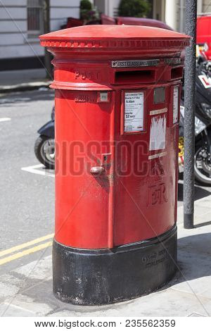 London, United Kingom - June 23, 2017: Traditional British Red Pillar Box, Free-standing Post Box On